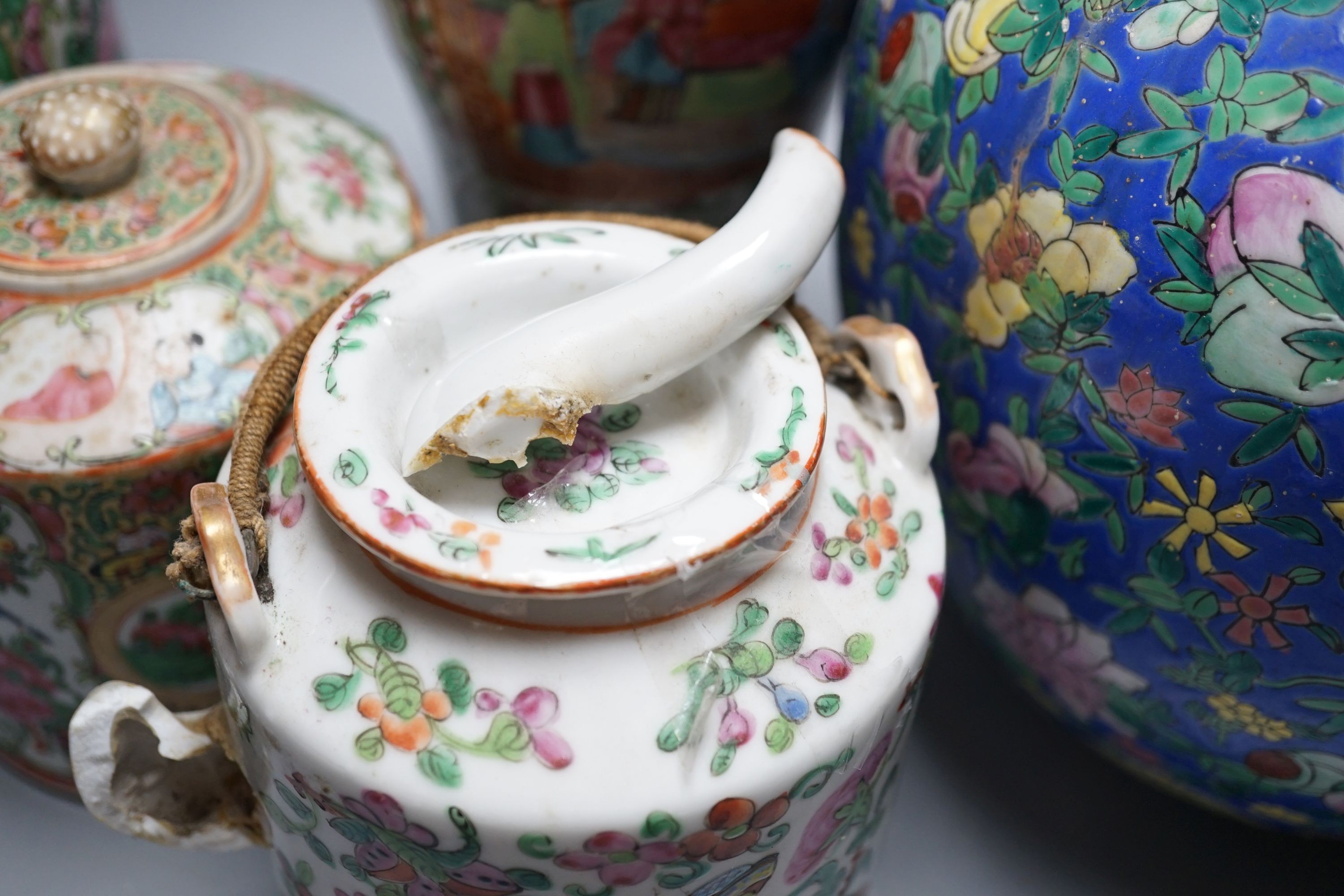 Two Chinese famille rose vases, two Chinese famille rose teapots and a blue ground enamelled jar tallest 26.5cm